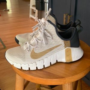 Rare, worn once Gold and Black womens Nike sneakers